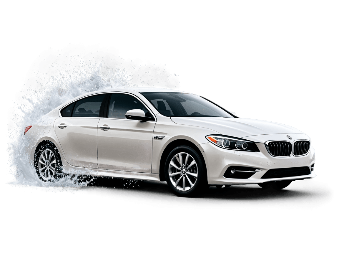 A white BMW sedan with a splash of water