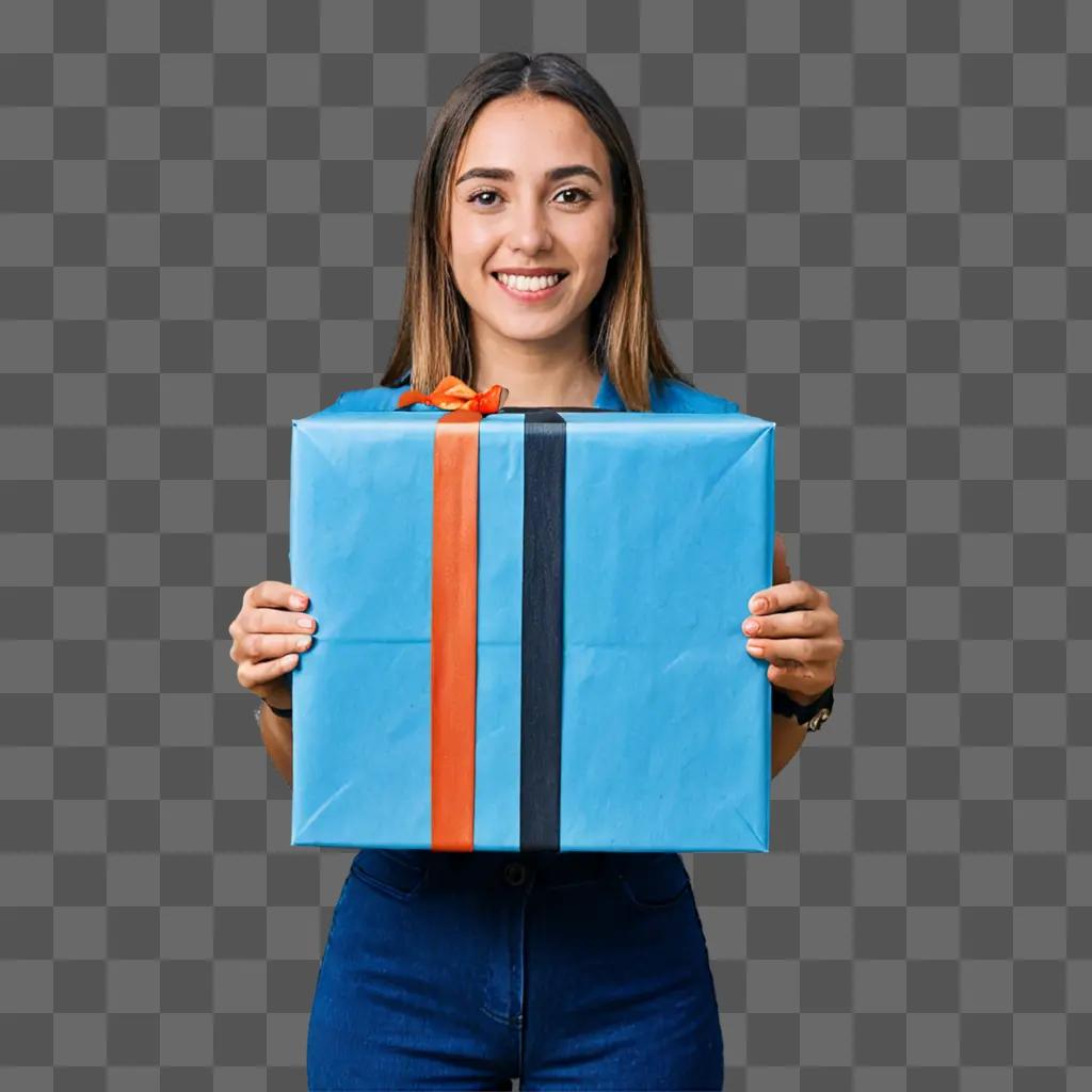 A girl holds a gift wrapped in blue with orange and black stripes