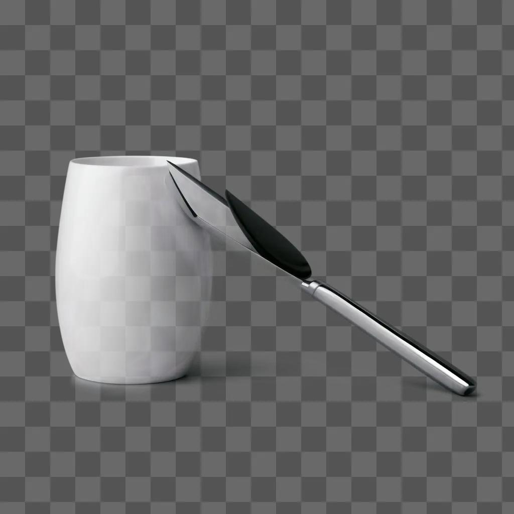 Black and white image of a knife and cup