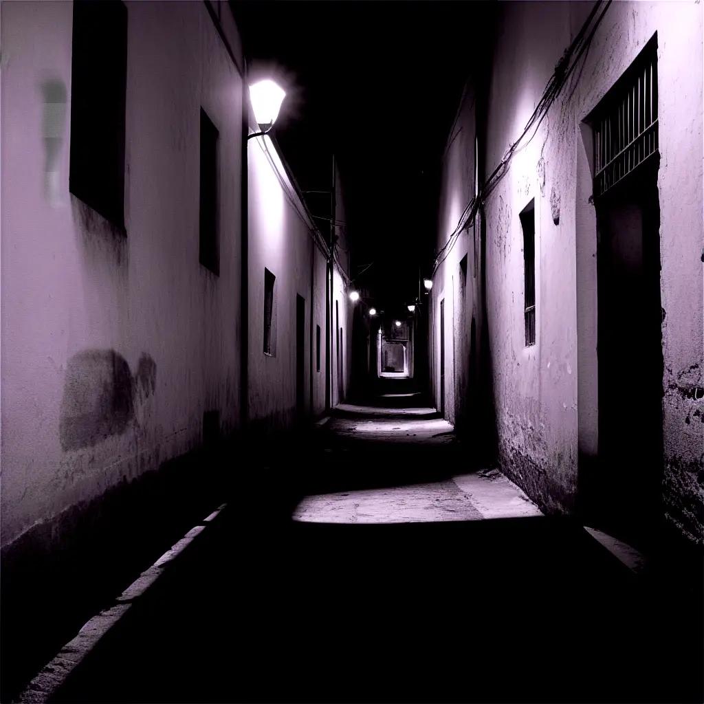 Dark alleyway with a light on a building