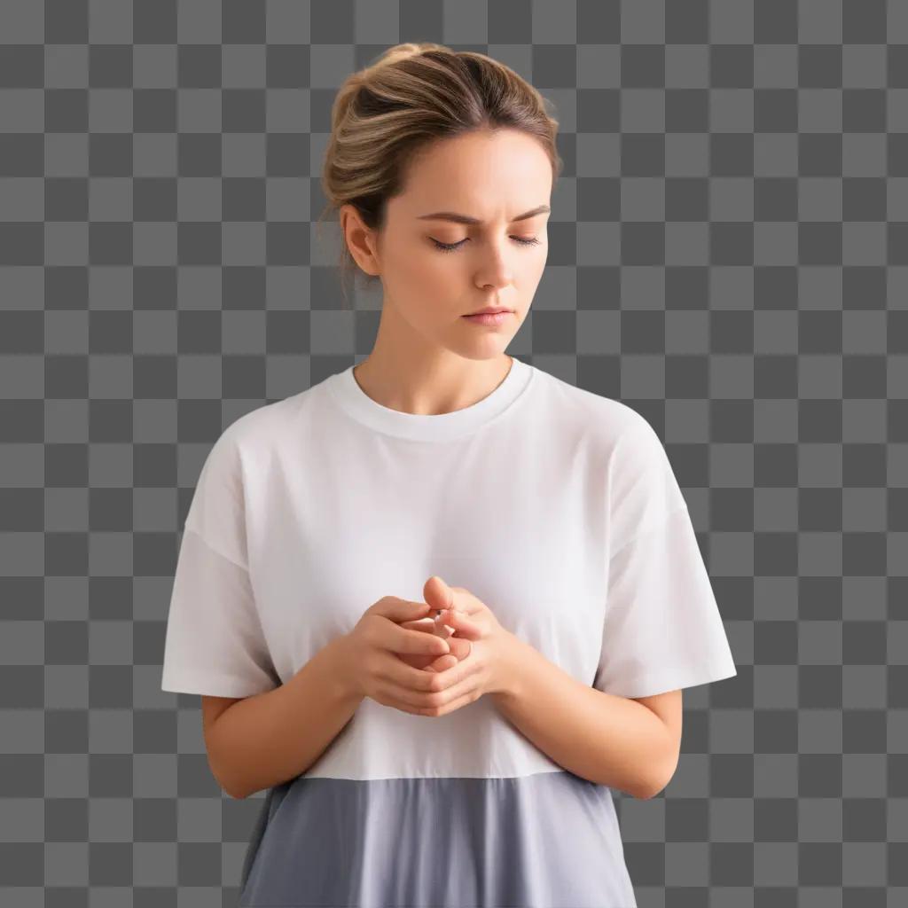 Focused woman in white shirt with closed eyes