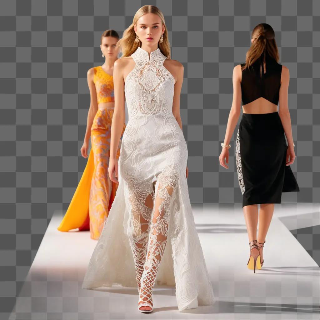 Models in white dresses walk on runway