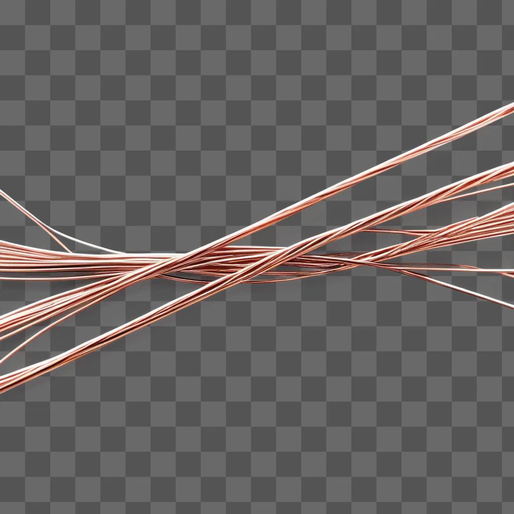 Several wires are twisted together on a pink background