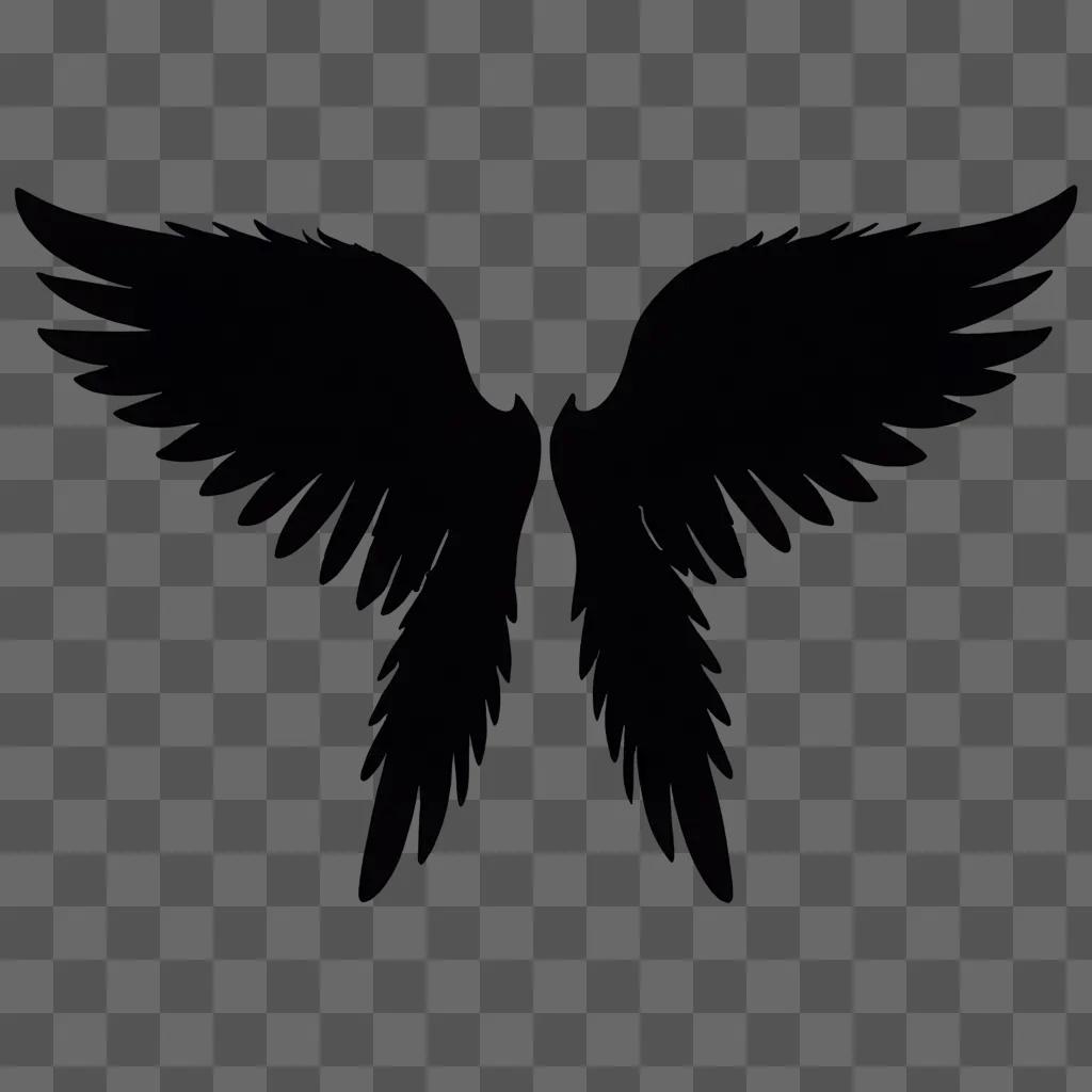 Silhouette of two angel wings against a dark background