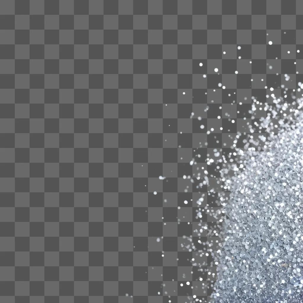 Silver glitter sparkles on a grey background