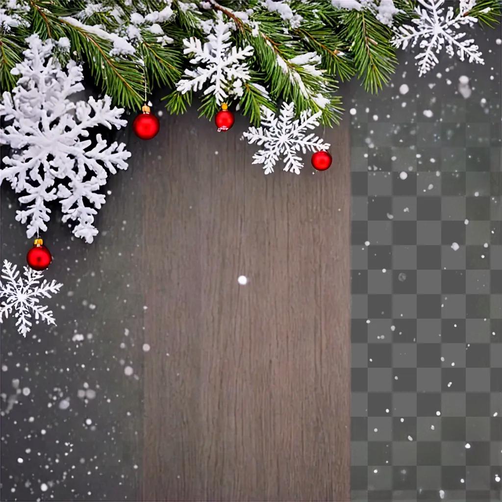 Snowy Christmas background with red ornaments and evergreen branches