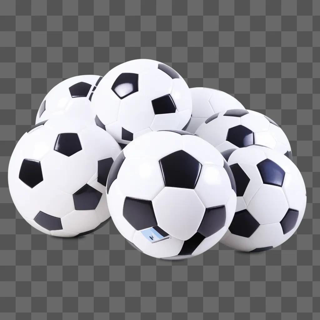 Soccer balls in a pile on a grey surface