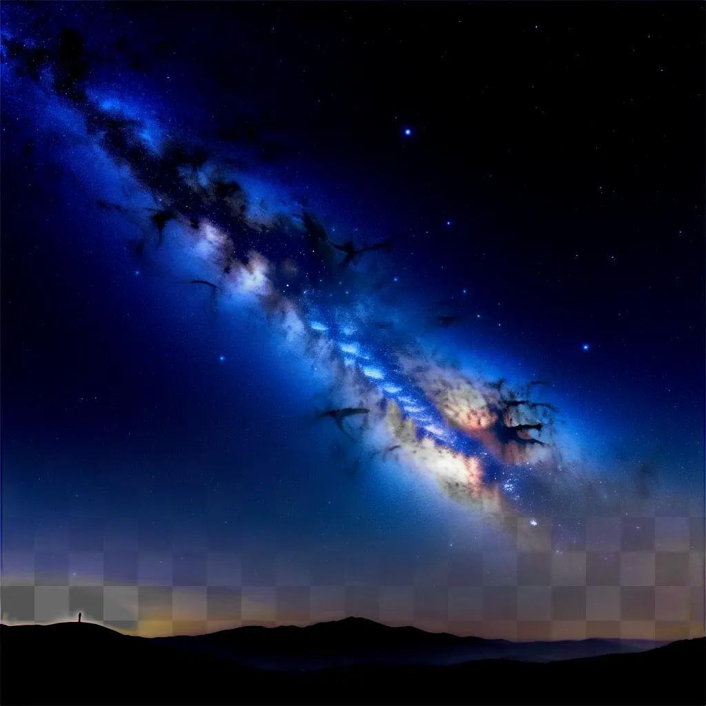 Starry sky with a spiral galaxy and mountains in the distance