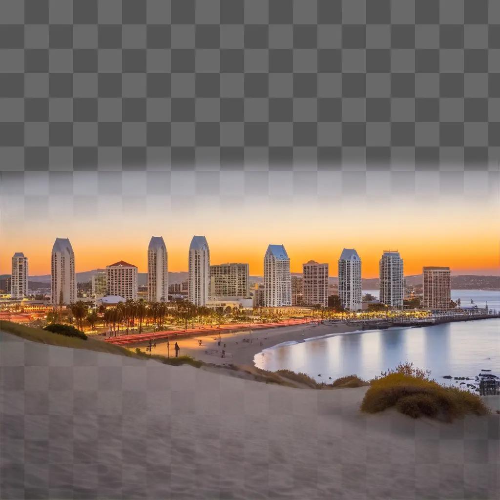 Sunset over San Diego skyline with ocean and sandy beach