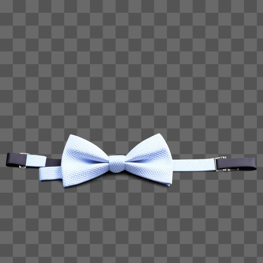 Tie with a white bow tie on a gray background