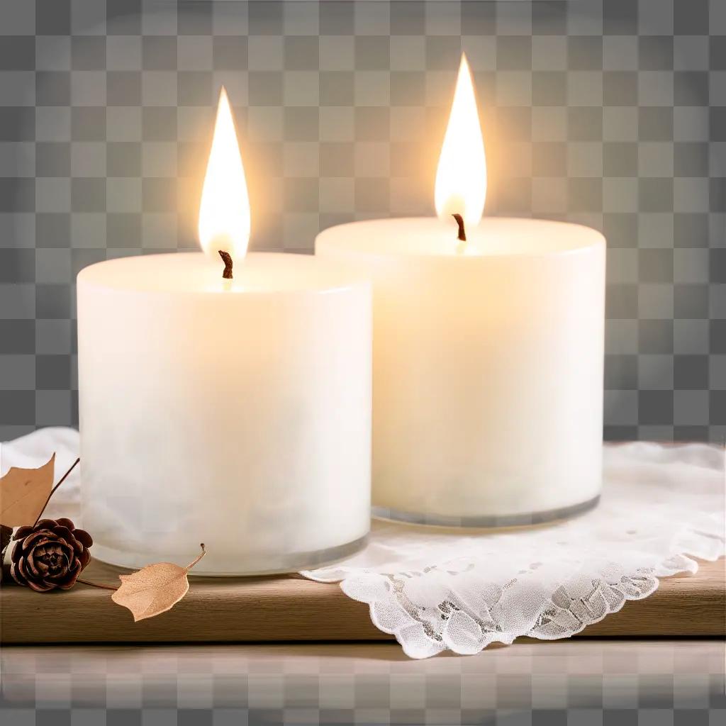 Two lit candles on a white lace tablecloth