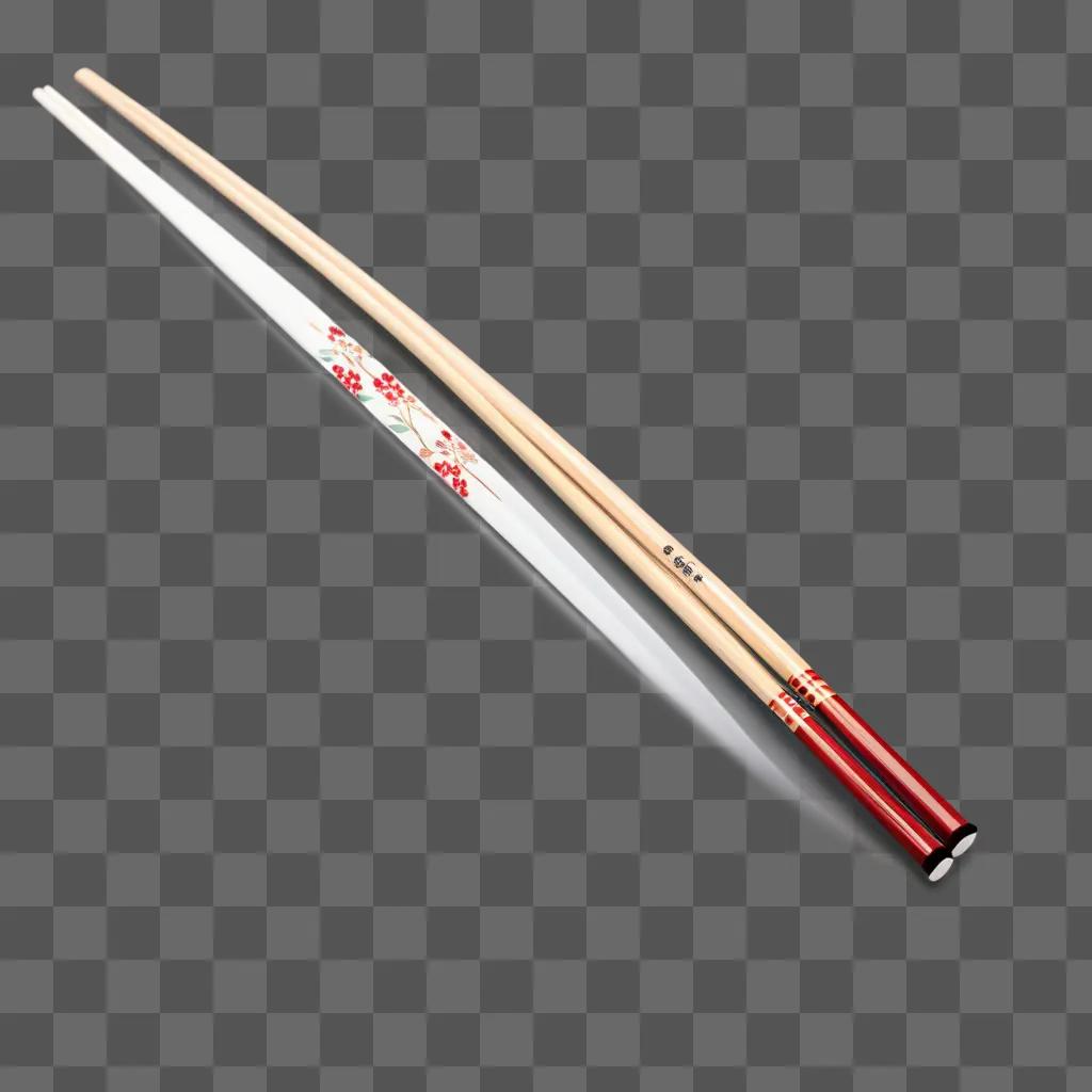 Two red chopsticks with flowers on them