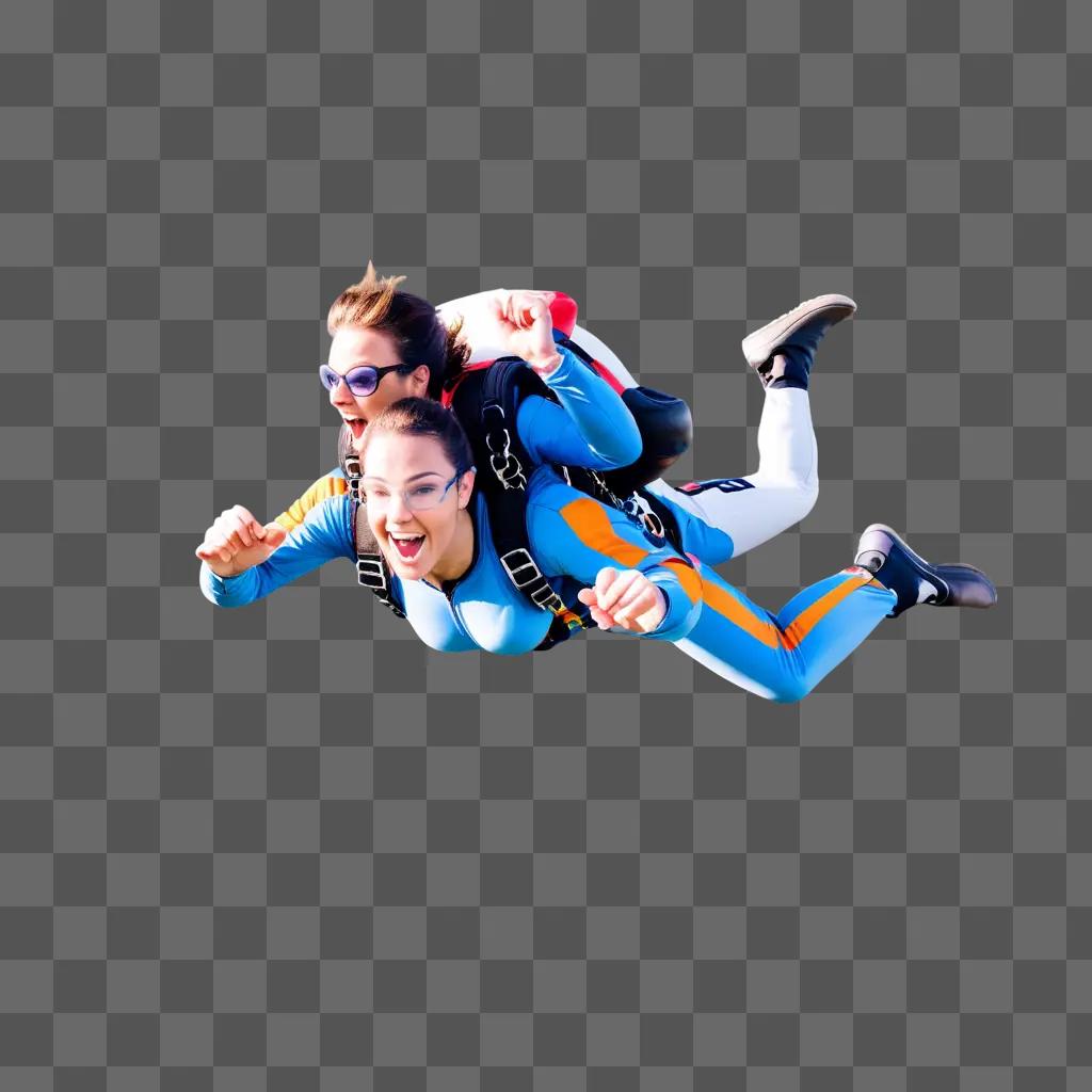 Two women skydiving, one wearing blue and the other wearing orange