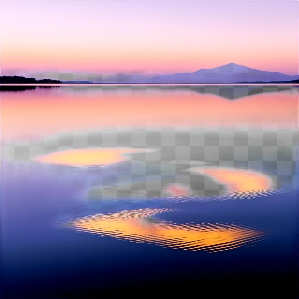 Water reflection at sunset with mountains and trees in the distance