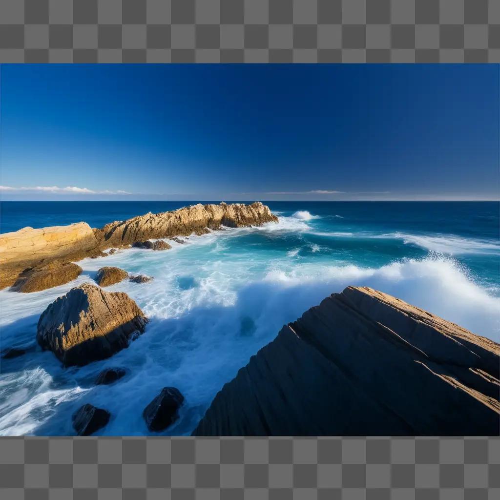 Waves crashing against a rocky shore on a clear day