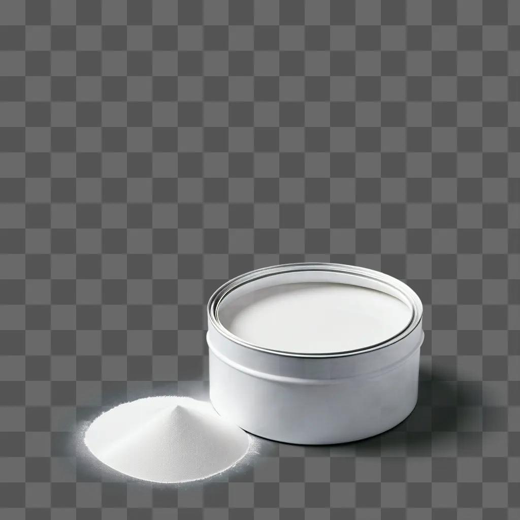 White paint in a metal can sits on a gray surface