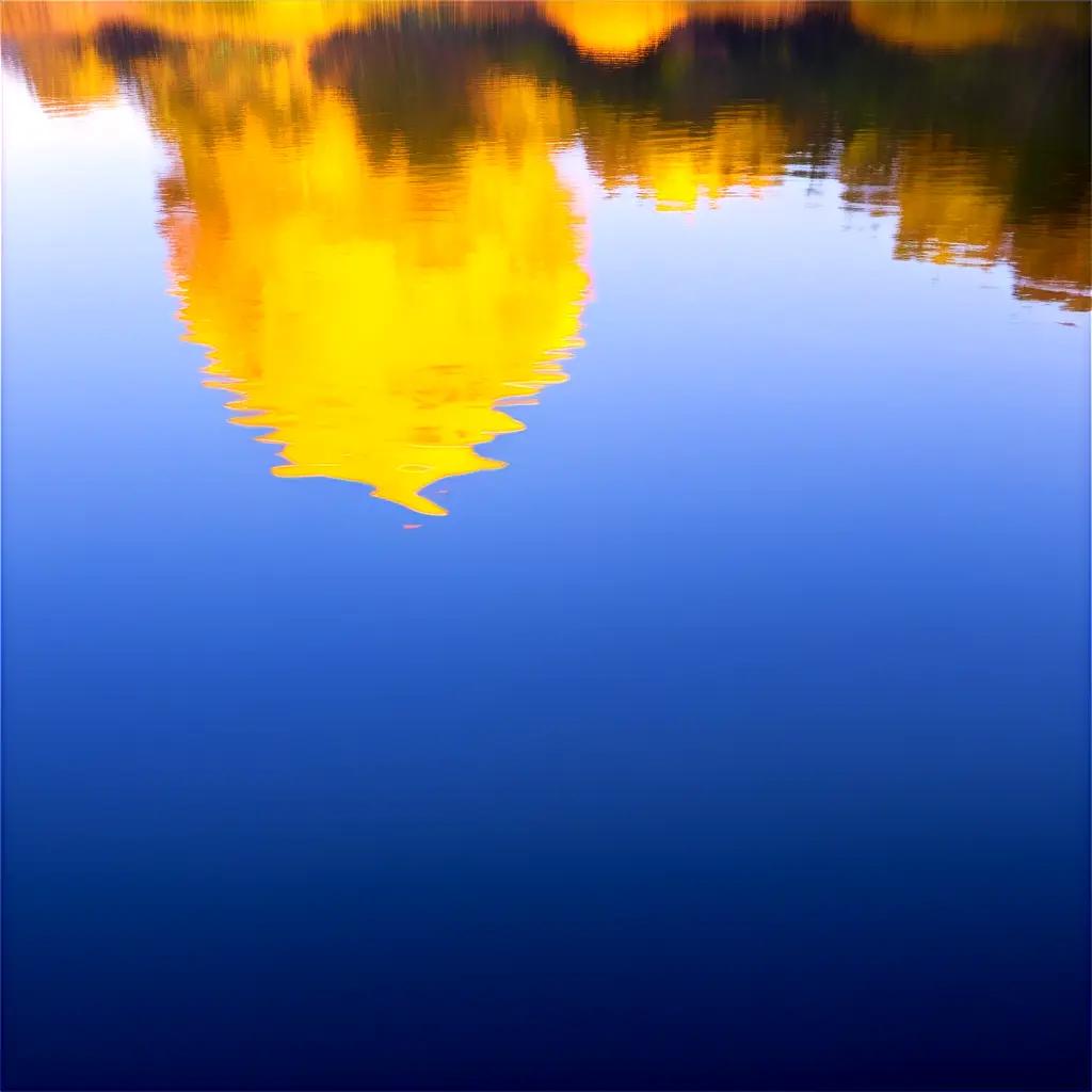 Yellow reflection of building in blue water