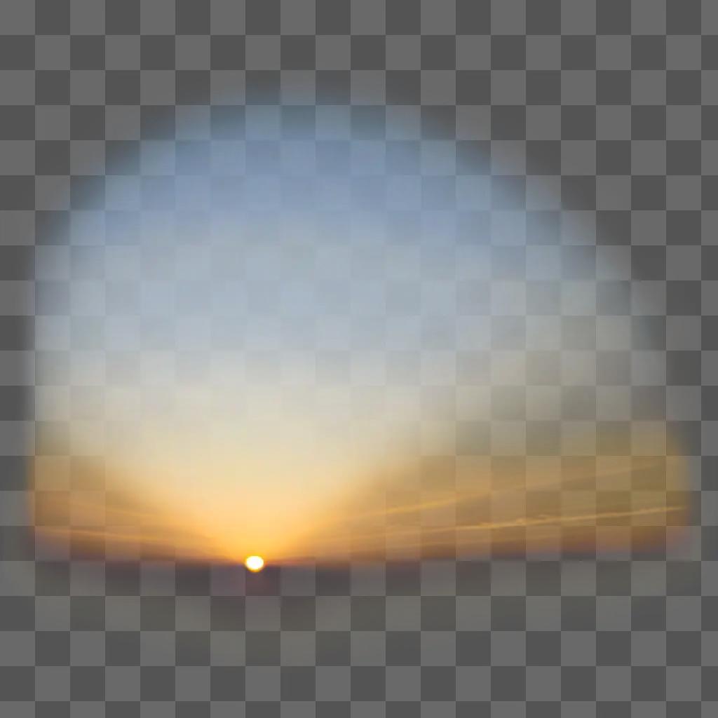 blurry sun rises over a cloudy sky