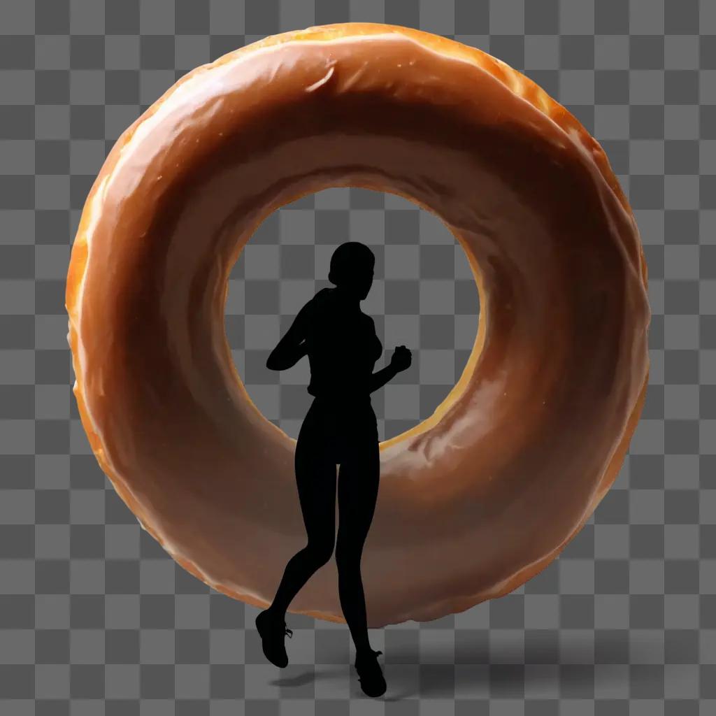 donut silhouette A womans silhouette in front of a glazed donut