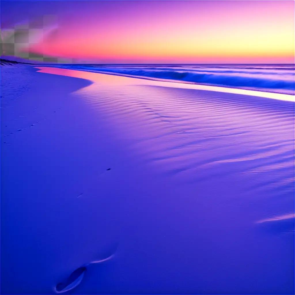 footprints on the beach under the sunset