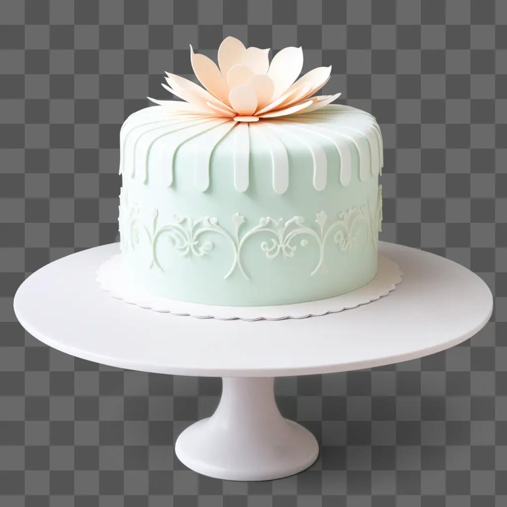 light green cake with a white flower on top