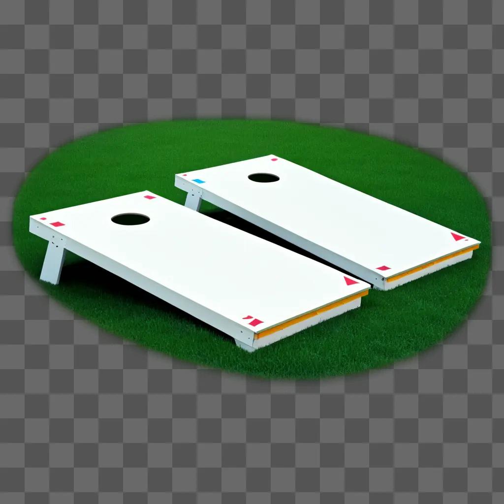 pair of cornhole boards on a grassy field