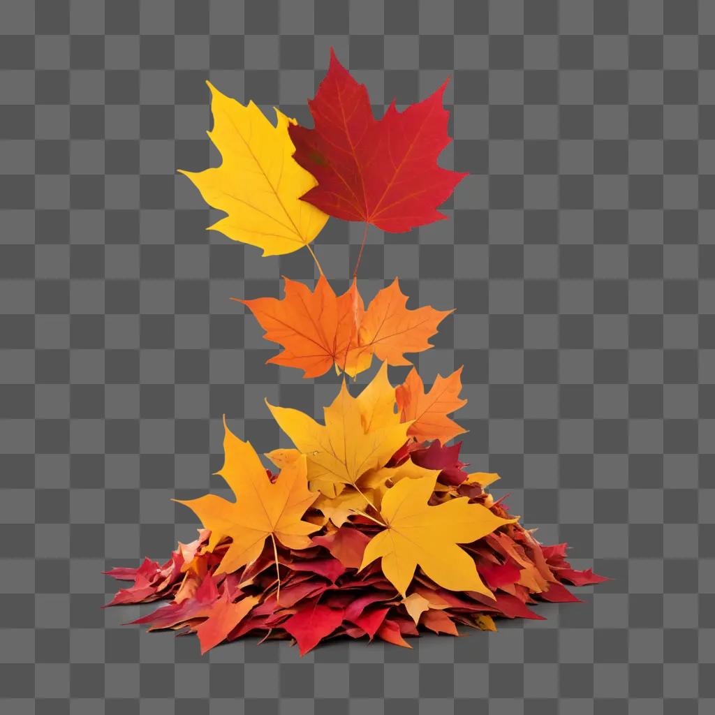 pile of colorful leaves in front of a orange background