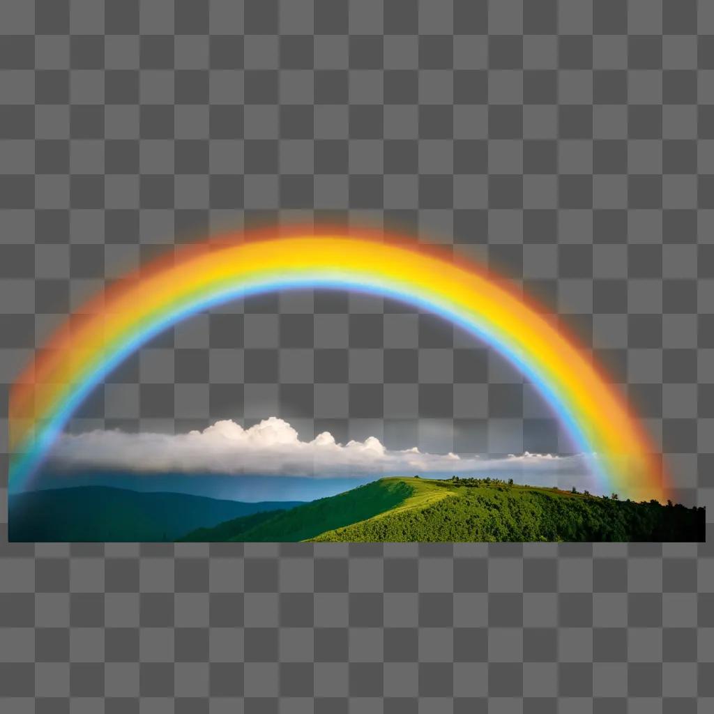 rainbow appears over a mountain range and clouds