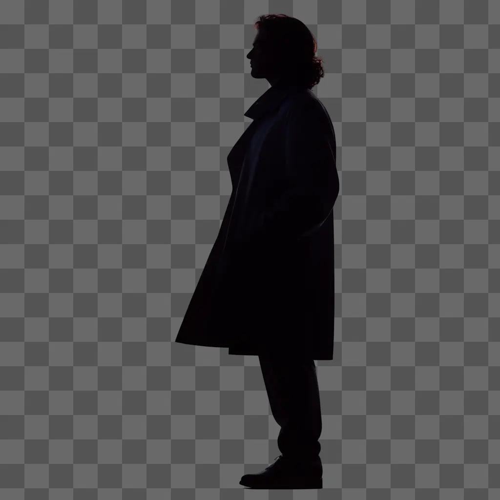 silhouette of a person in a trench coat