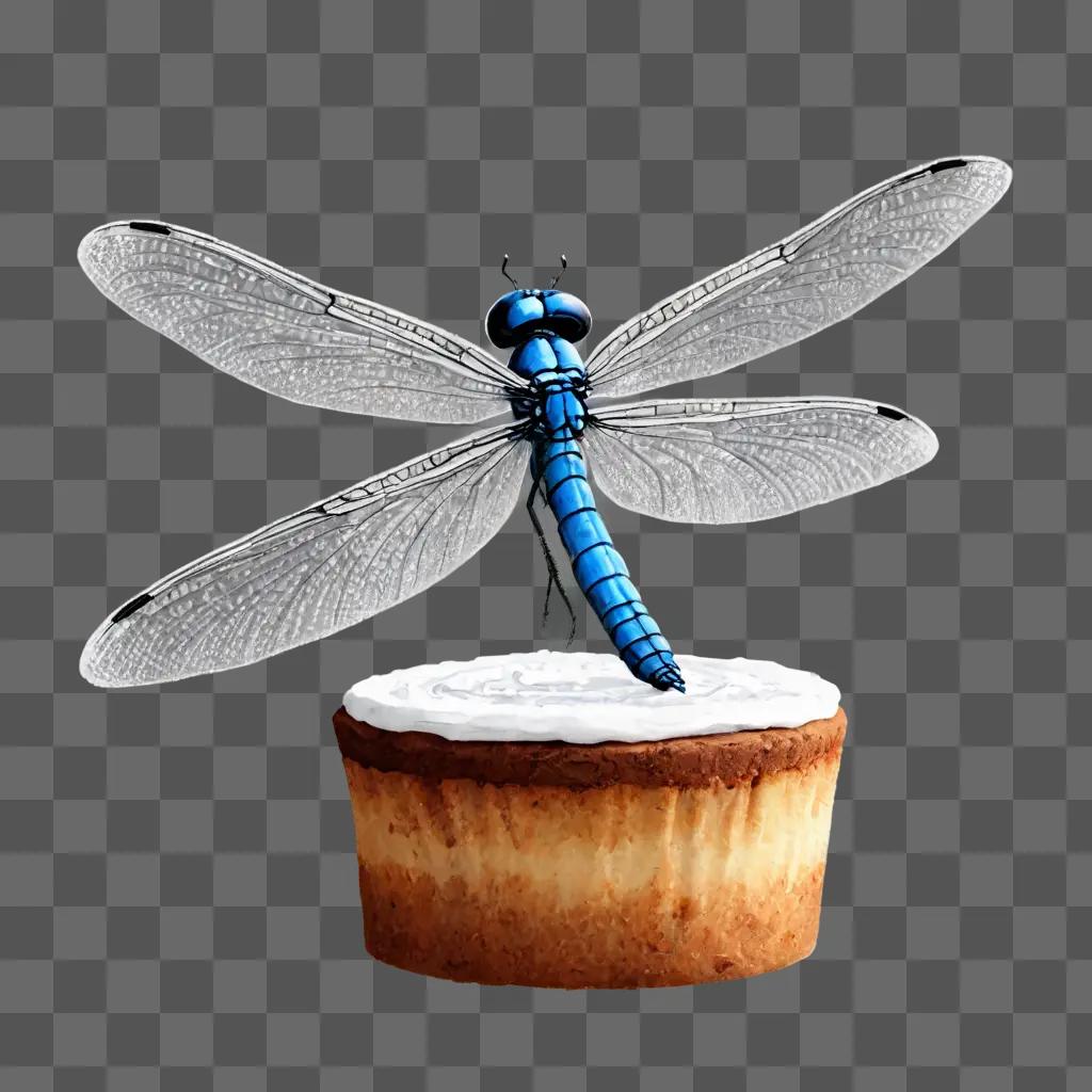 sketch cake drawing A blue dragonfly on a cupcake with white icing