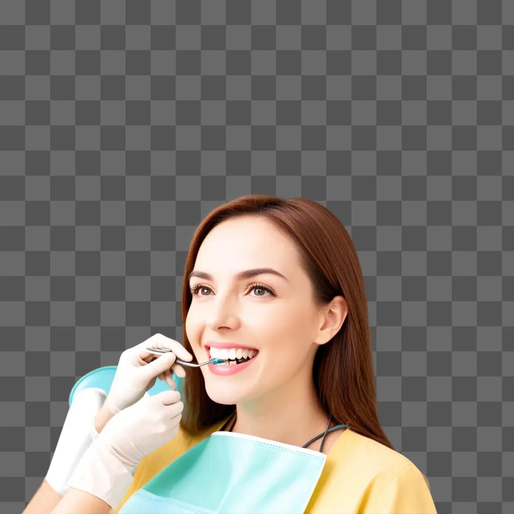 smiling woman with a yellow shirt and glove, getting a dental procedure