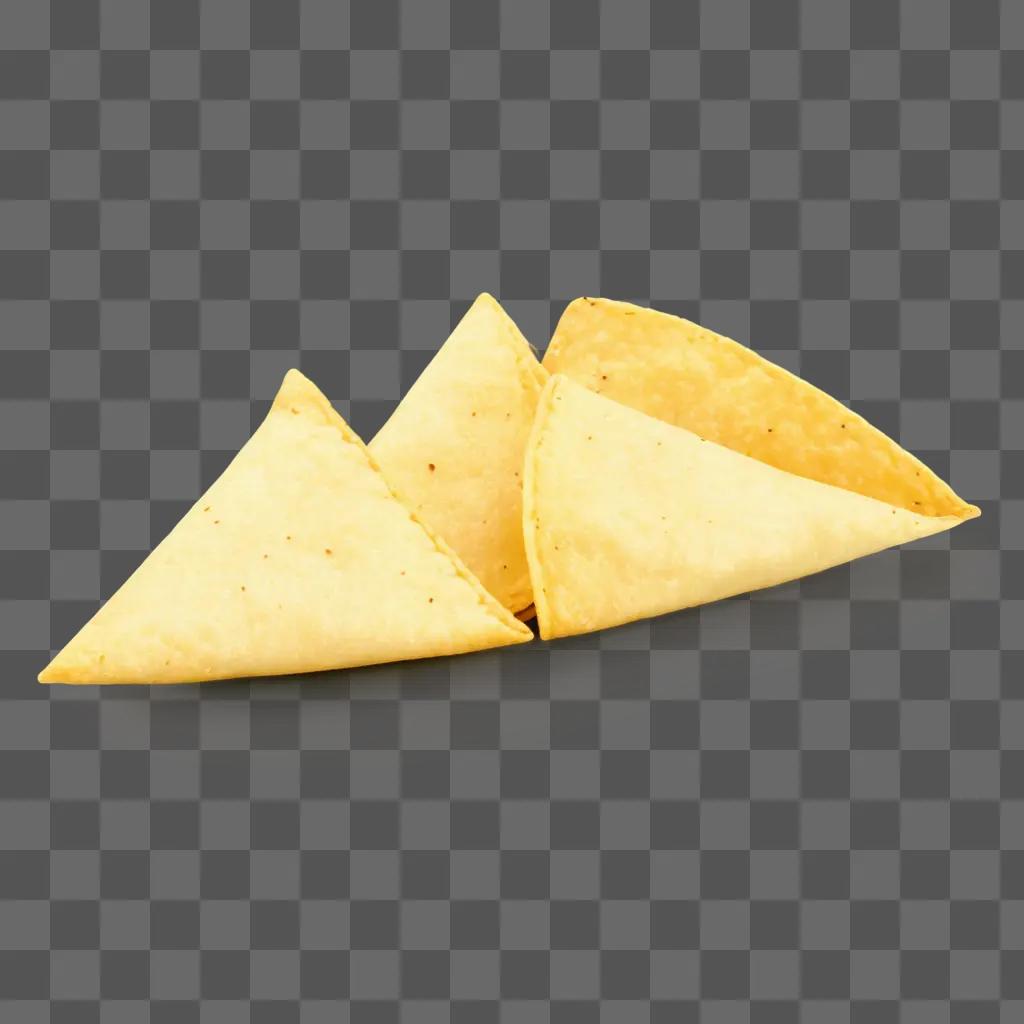 stack of three tortilla chips on a yellow background