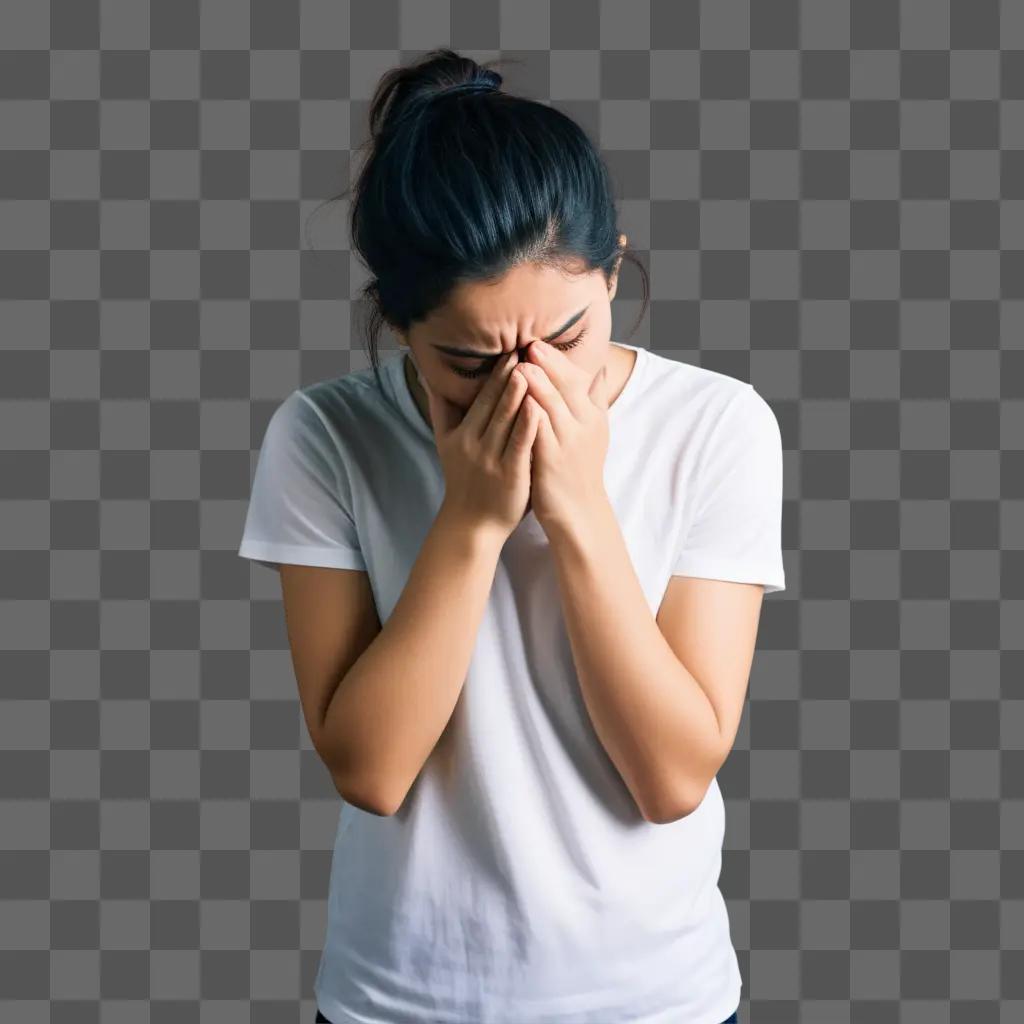 woman covering her face with hands in distress