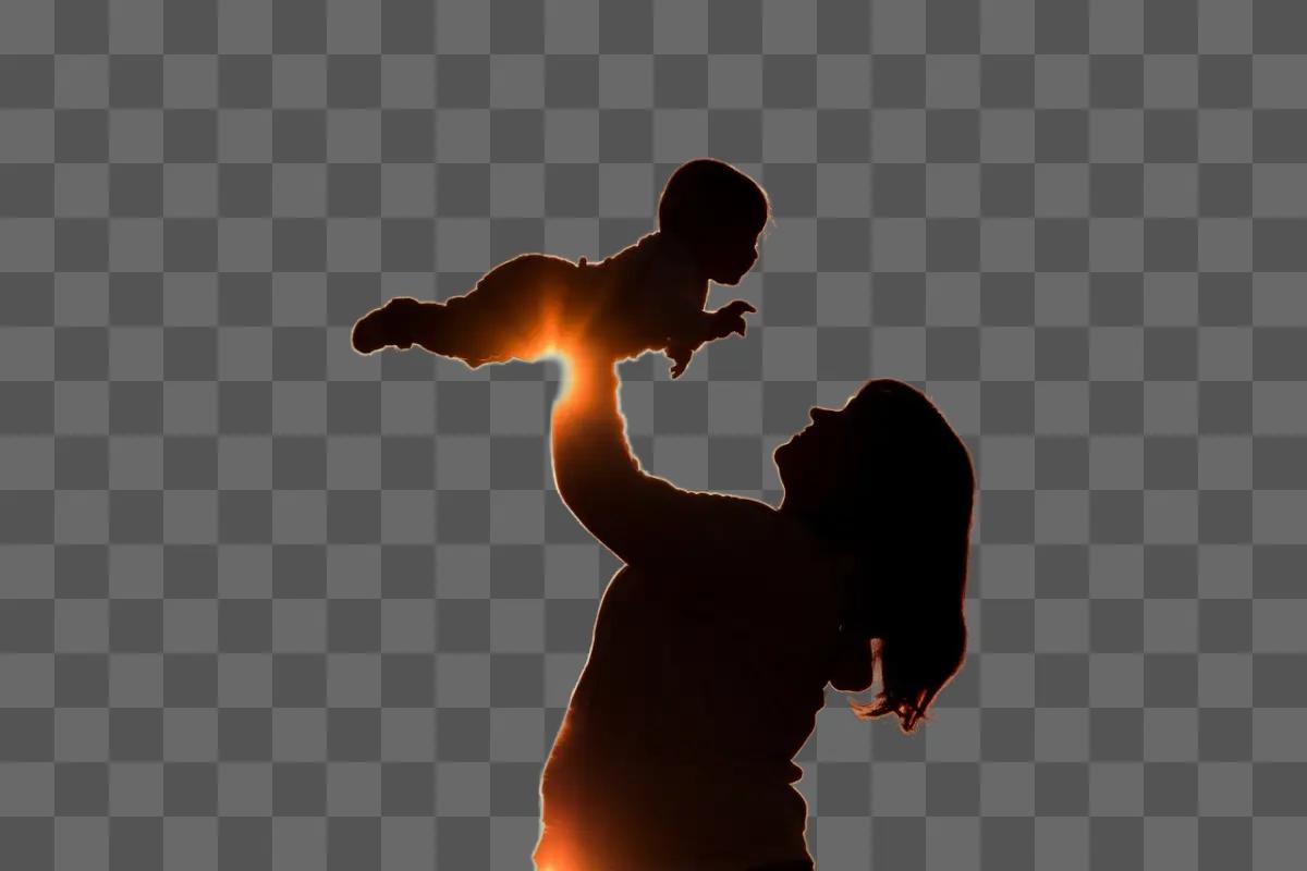 woman holding a baby up in the air