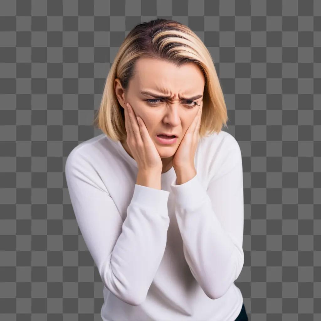 woman in a white shirt shows pain