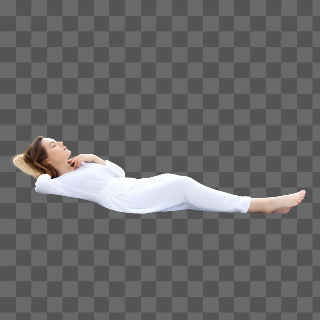 woman lies in a white outfit against a gray background